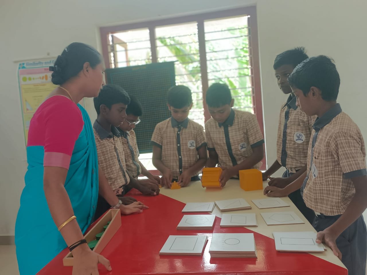Mentor guiding a student in math lab